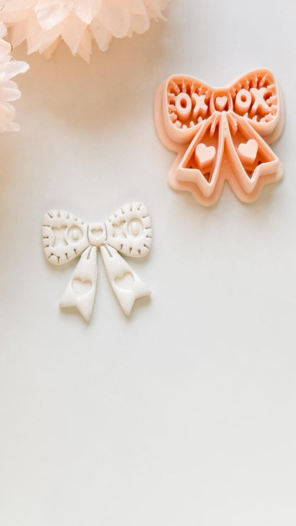 XOXO Bow Clay Cutter: Heart Ribbon Design with Script Embossing