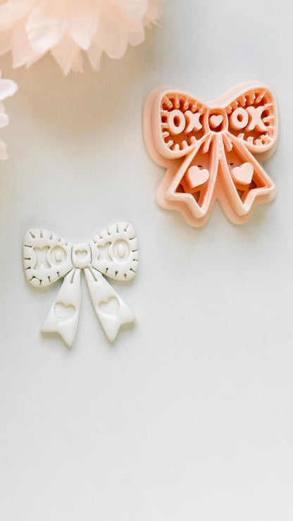 XOXO Bow Clay Cutter: Heart Ribbon Design with Script Embossing
