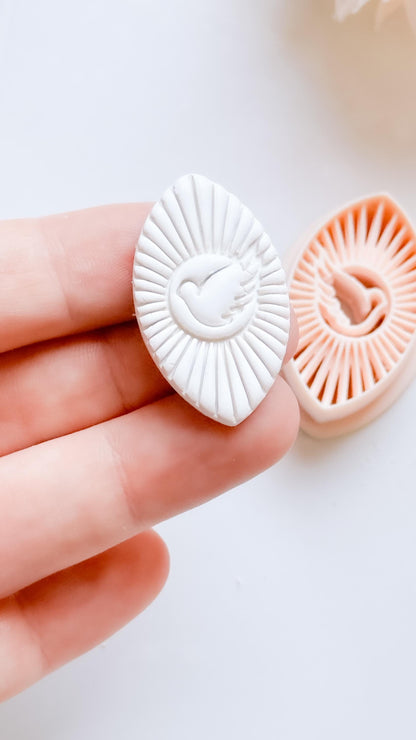 Radiant Dove Cutter: Winged Dove with Sunburst Shape for Polymer Clay