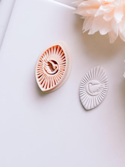 Radiant Dove Cutter: Winged Dove with Sunburst Shape for Polymer Clay