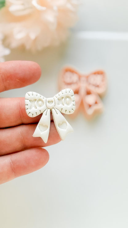 XOXO Bow Clay Cutter: Heart Ribbon Design with Script Embossing