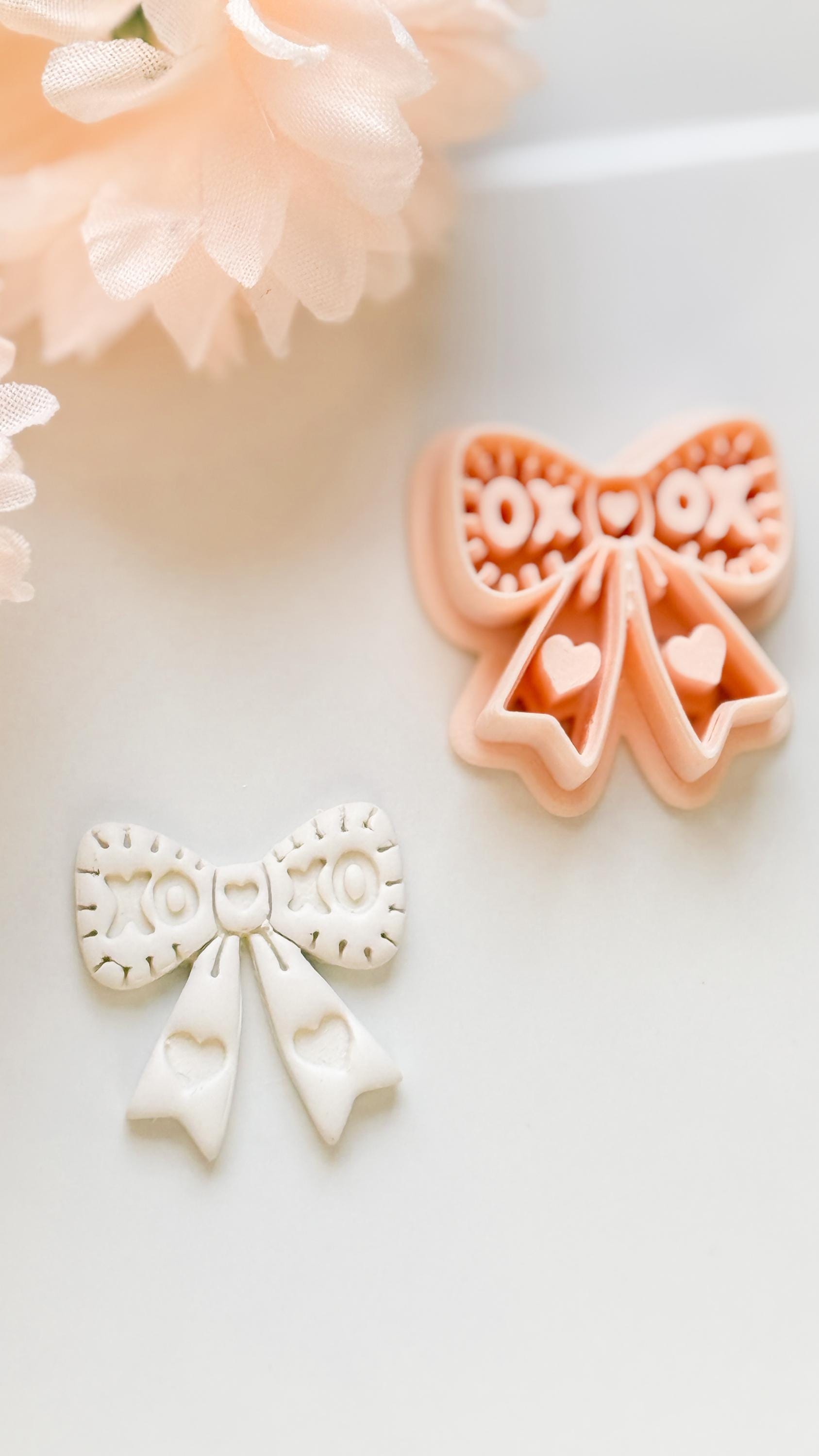 XOXO Bow Clay Cutter: Heart Ribbon Design with Script Embossing