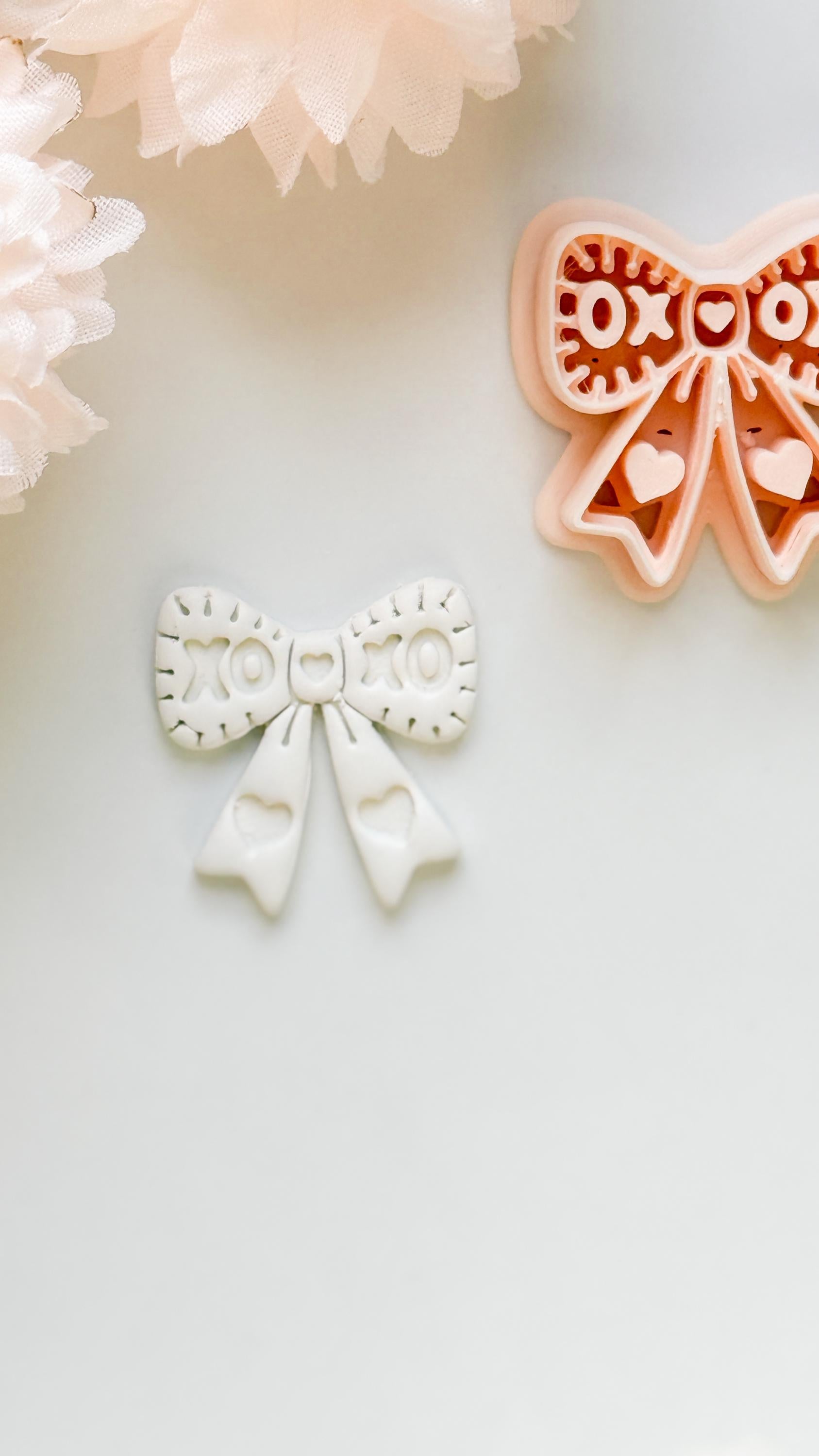 XOXO Bow Clay Cutter: Heart Ribbon Design with Script Embossing