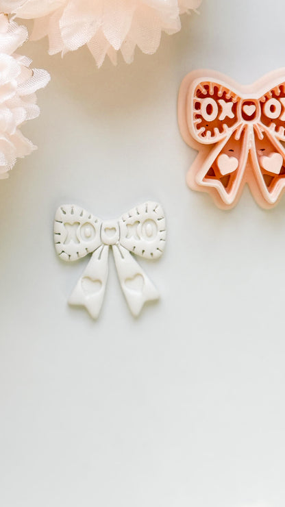 XOXO Bow Clay Cutter: Heart Ribbon Design with Script Embossing