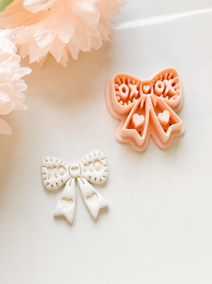 XOXO Bow Clay Cutter: Heart Ribbon Design with Script Embossing