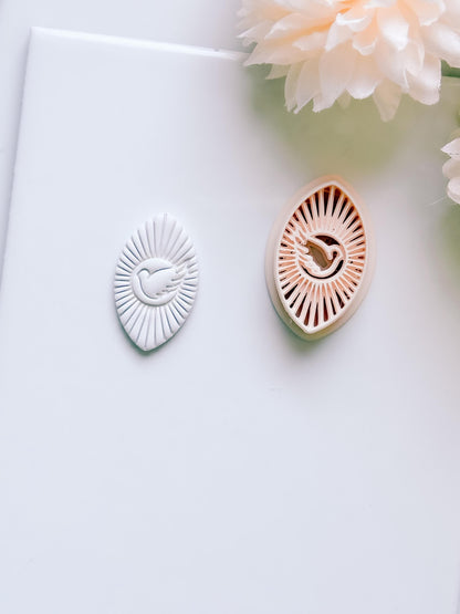 Radiant Dove Cutter: Winged Dove with Sunburst Shape for Polymer Clay