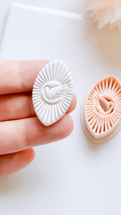Radiant Dove Cutter: Winged Dove with Sunburst Shape for Polymer Clay