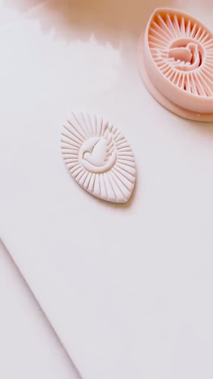 Radiant Dove Cutter: Winged Dove with Sunburst Shape for Polymer Clay